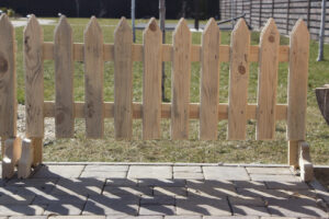 small wooden fence with pegs